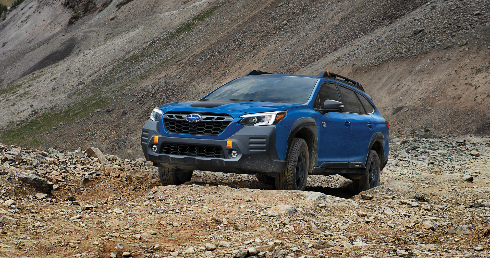 A 2023 Outback Wilderness driving on a trail in the mountains. | Mid-Hudson Subaru in Wappingers Falls NY
